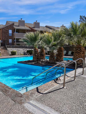 Exterior with pool at The Chimneys Apartments in El Paso, Texas
