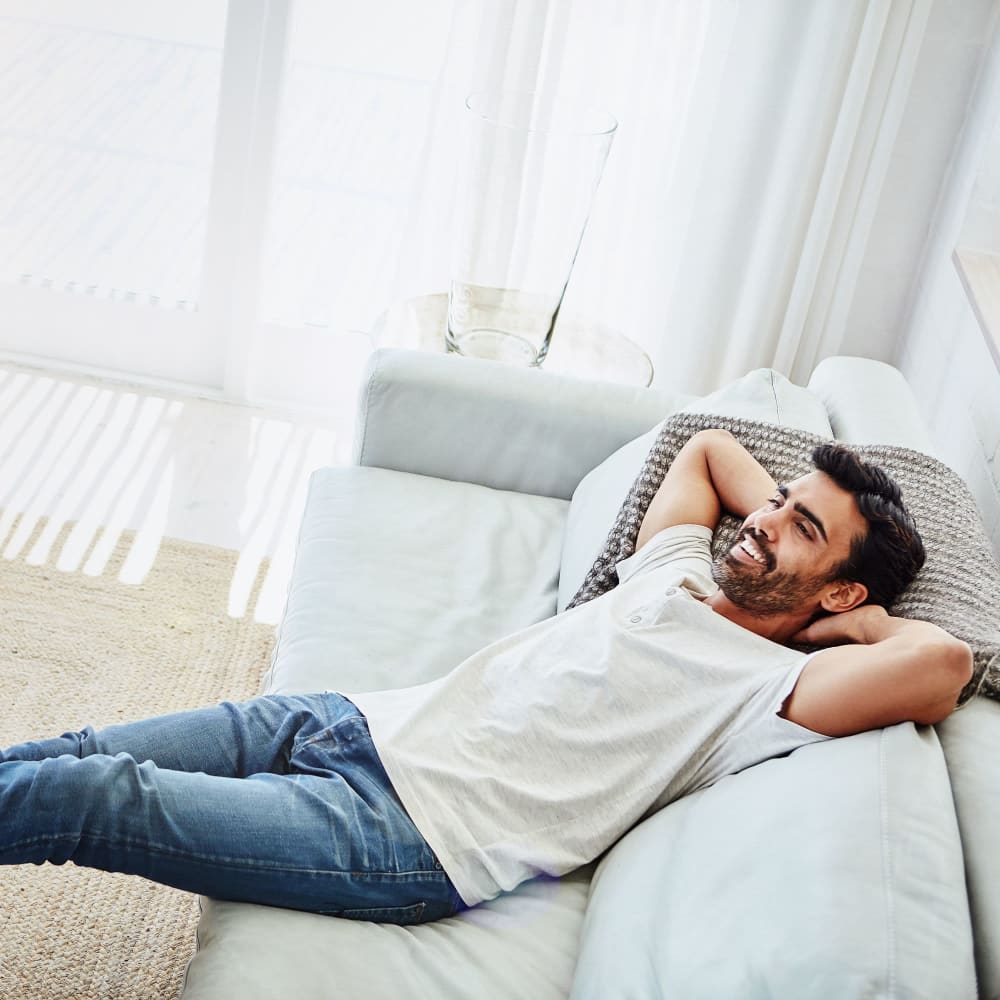 Resident relaxing in his new apartment at Lutkin Bayou Apartments in Drew, Mississippi