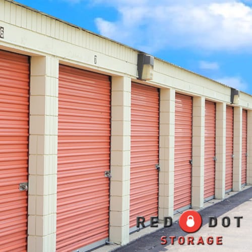 Outdoor storage units with red doors at Red Dot Storage in Zion, Illinois