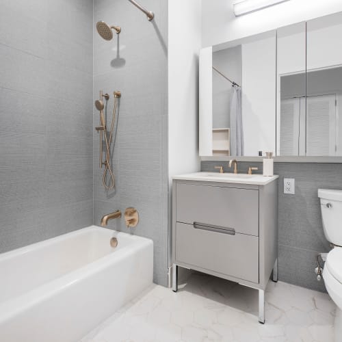 Rendering luxurious bathroom apartment at 8 Court Square in Long Island City, New York