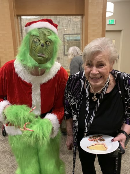 An Auburn (WA) resident take a picture with the Grinch.