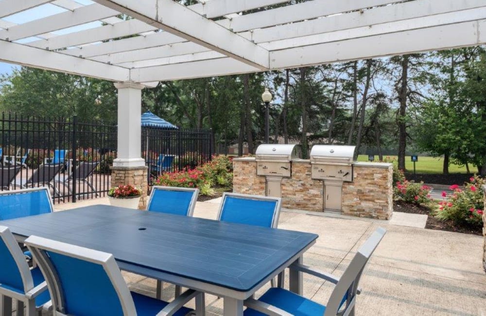 Exterior with pergola and grilling stations at Chesapeake Glen Apartment Homes in Glen Burnie, Maryland