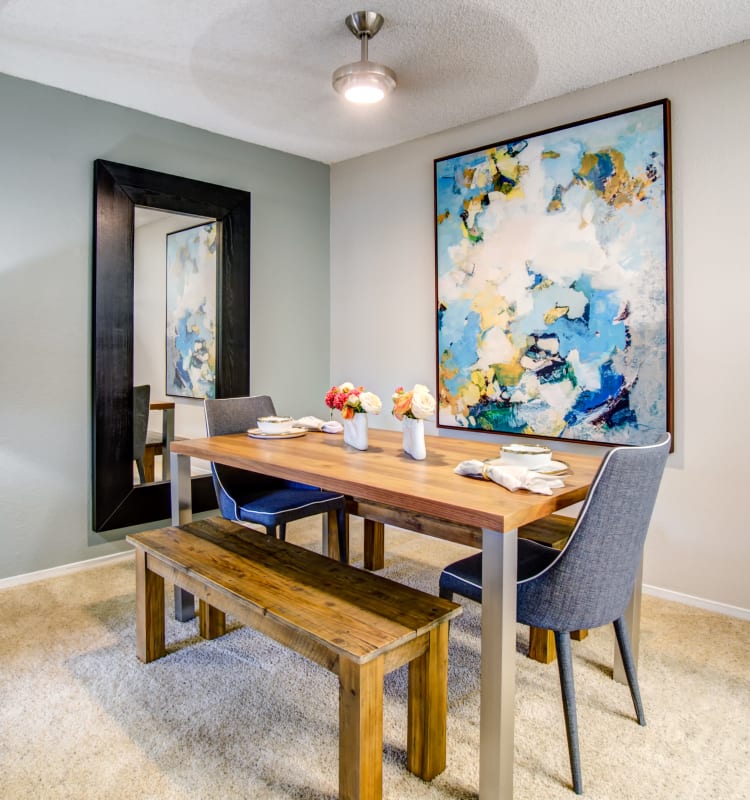Well-decorated dining area with a ceiling fan in a model home at Vue Fremont in Fremont, California