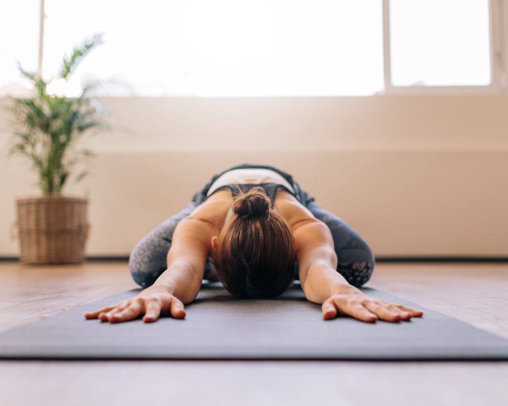 Resident doing some yoga in the fitness center at Sofi Fremont in Fremont, California
