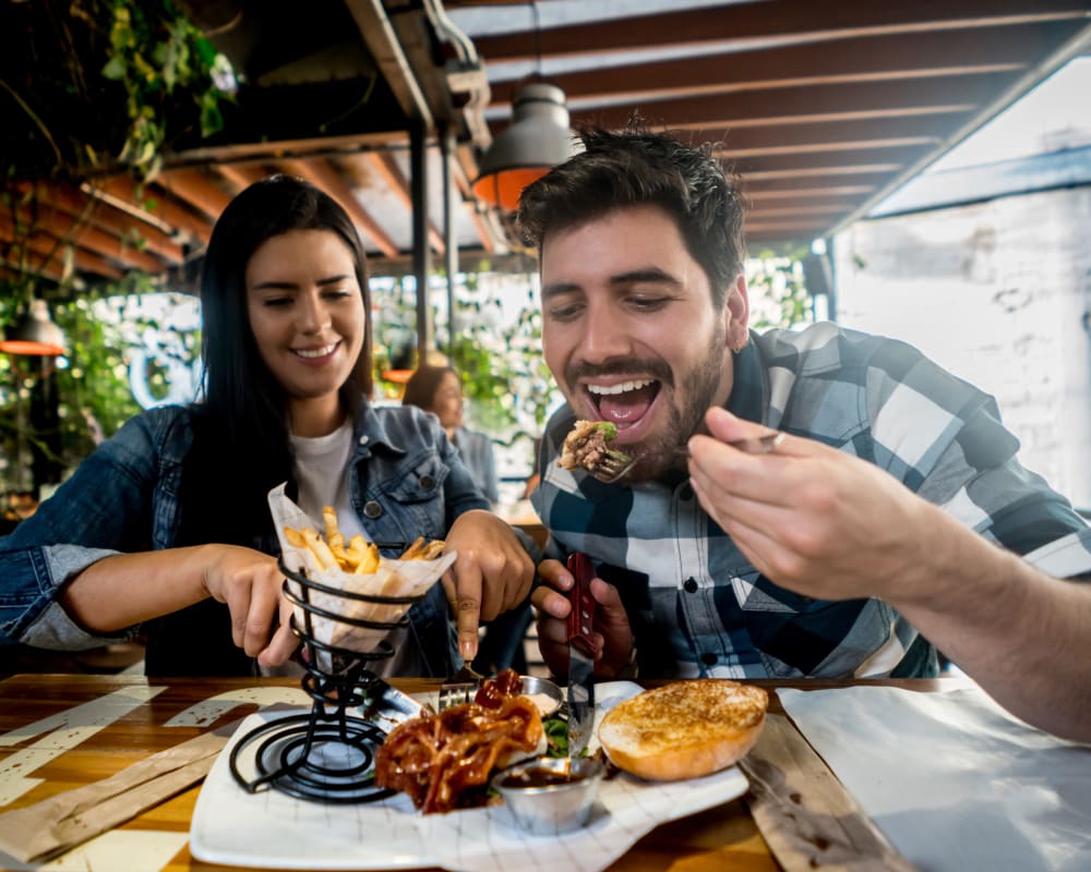 A happy couple eating near Sampson Road in Dahlgren, Virginia