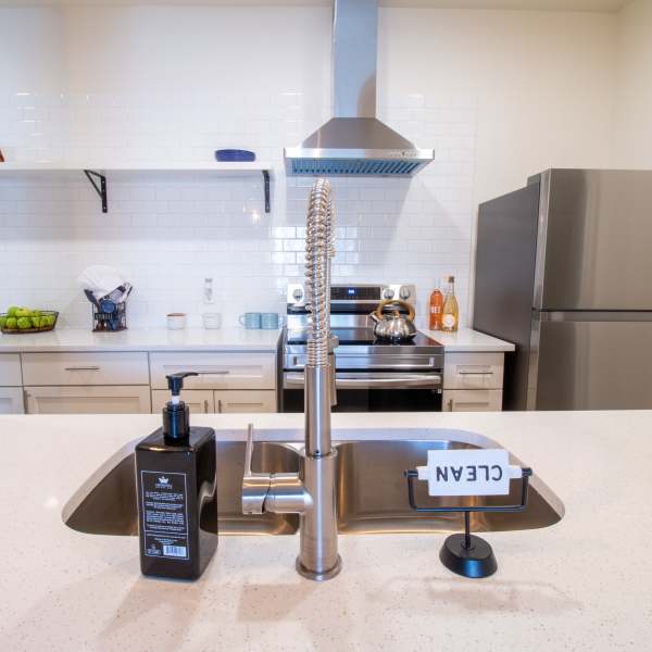 Kitchen with stainless steel appliances at Sutton in Austin, Texas