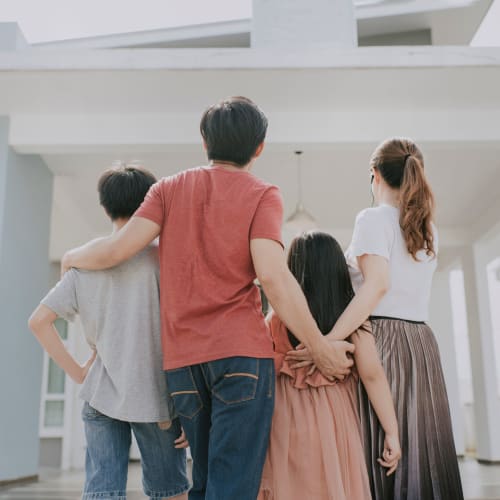 A family walking towards a home at Challenger Estates in Patuxent River, Maryland