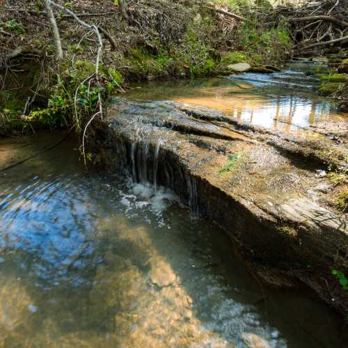 A flowing creek at Town Center Crossing in Kingwood, Texas