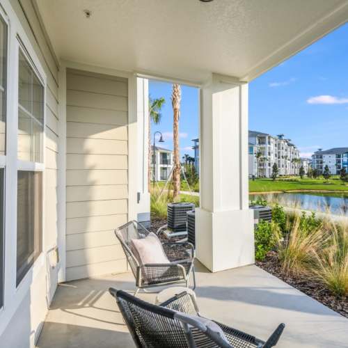 Exterior view with from a balcony at Champions Vue Apartments in Davenport, Florida