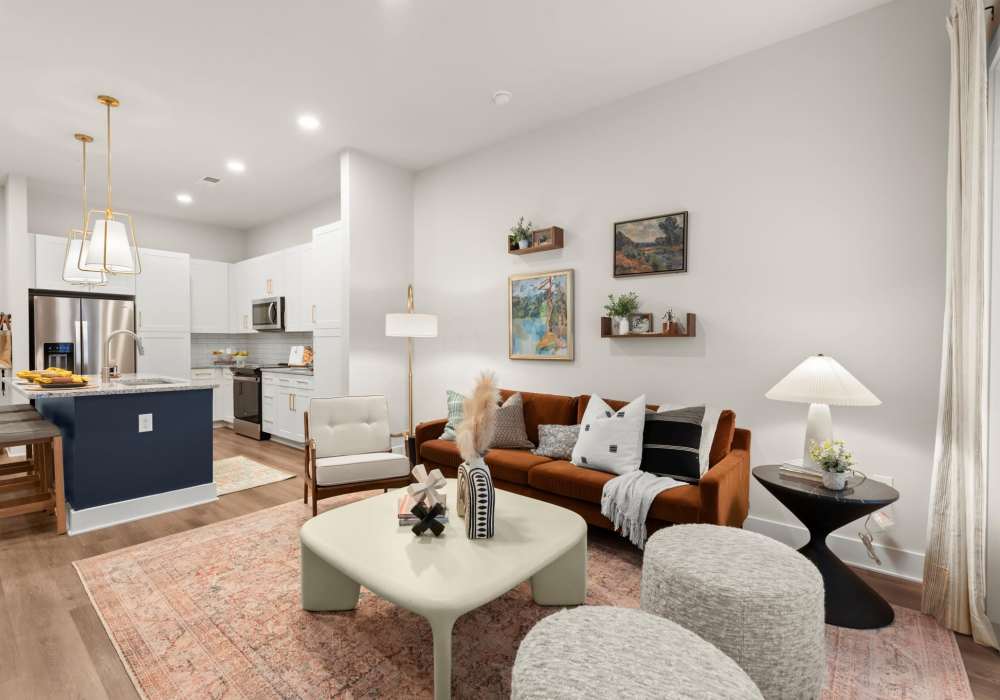A stylish living room that includes a comfy couch at EVOQ East Cobb in Marietta, Georgia