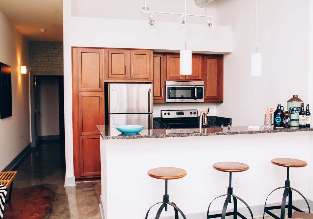 Kitchen with refrigerator at City View Lofts in Richmond, Virginia 