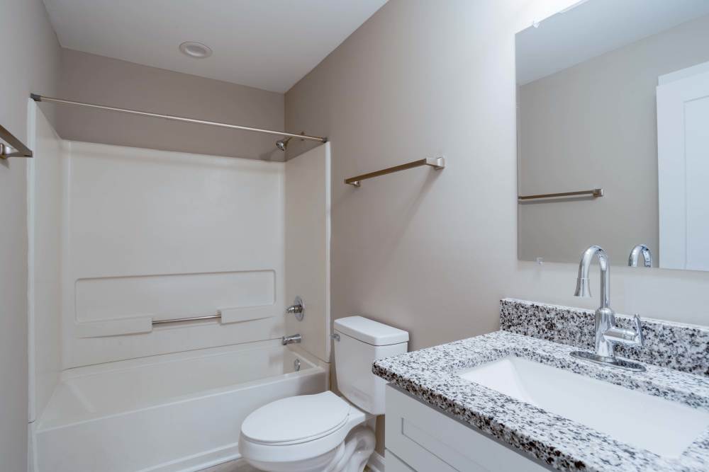 Renovated bathroom with granite vanity top