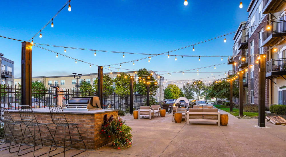 Outdoor lounge and evening lights at Penn Circle in Carmel, Indiana