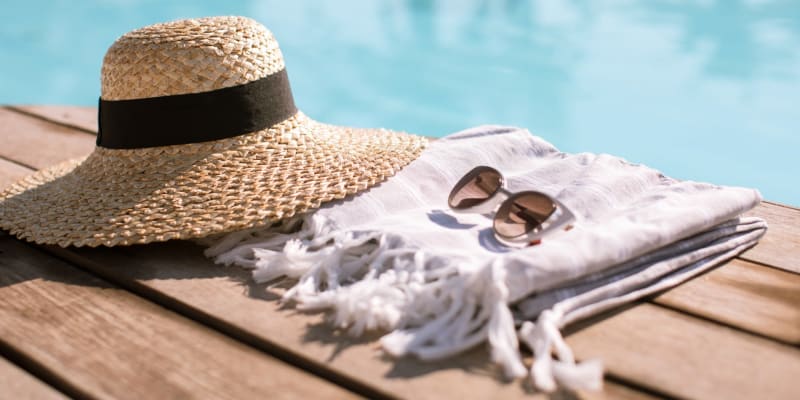 a hat and sunglasses by the pool at Shadow Mountain in Twentynine Palms, California