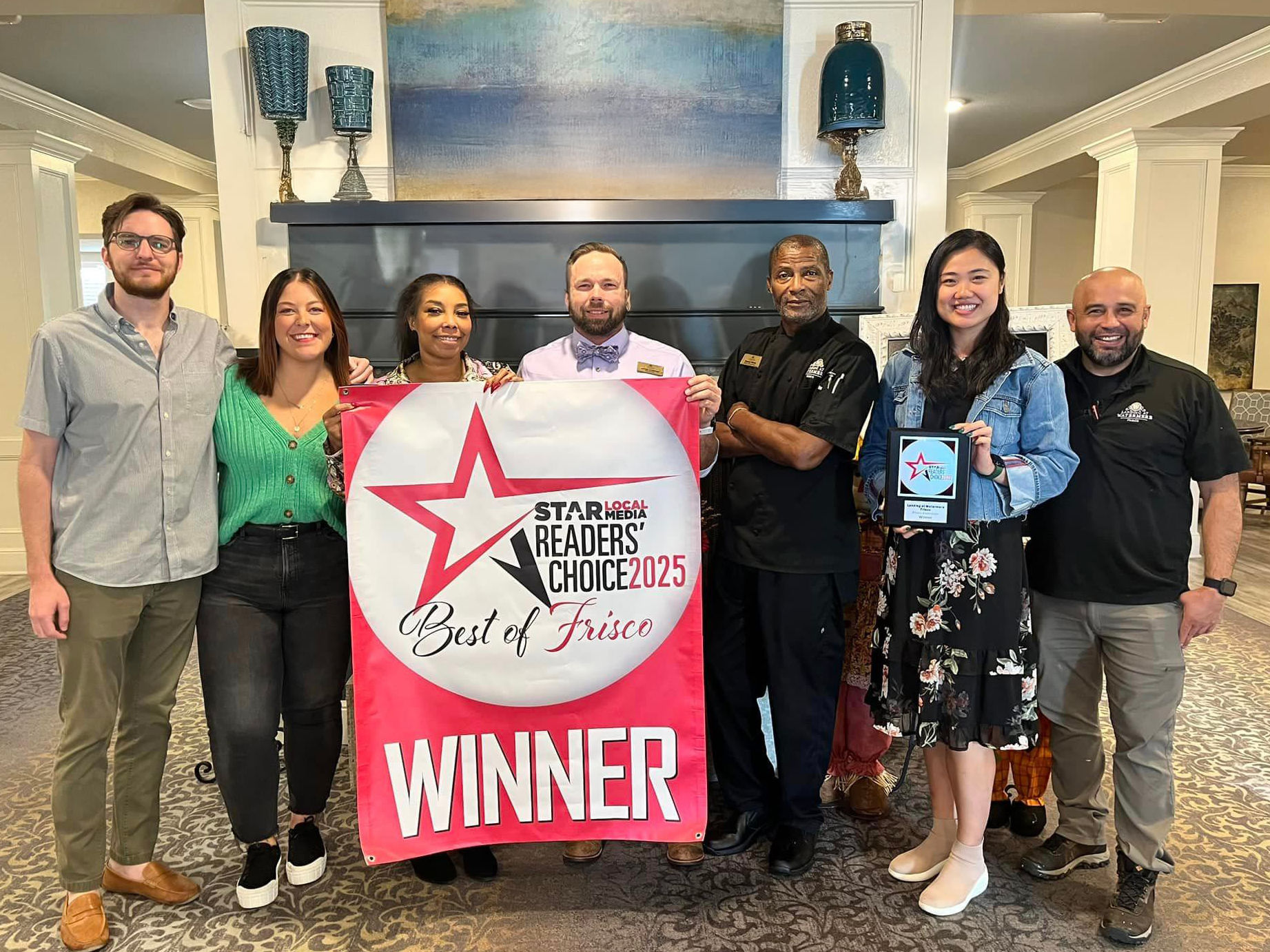 Landing at Watermere Frisco team proudly holding 2022 Best of Frisco Star Local Media Readers’ Choice Award banner.