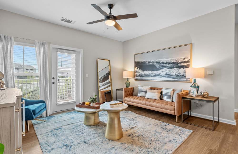 Spacious living room with 9-foot ceiling and ceiling fan at North Bay Landing in Panama City, Florida