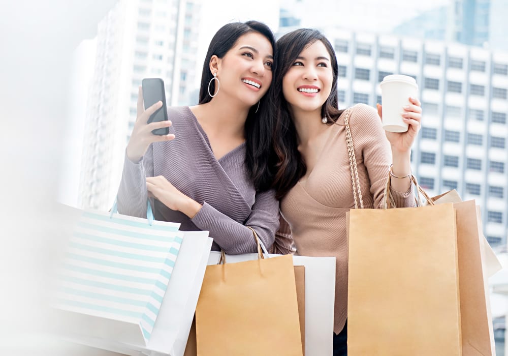 Friends shopping together near Oakwood Apartments in West Carrollton, Ohio