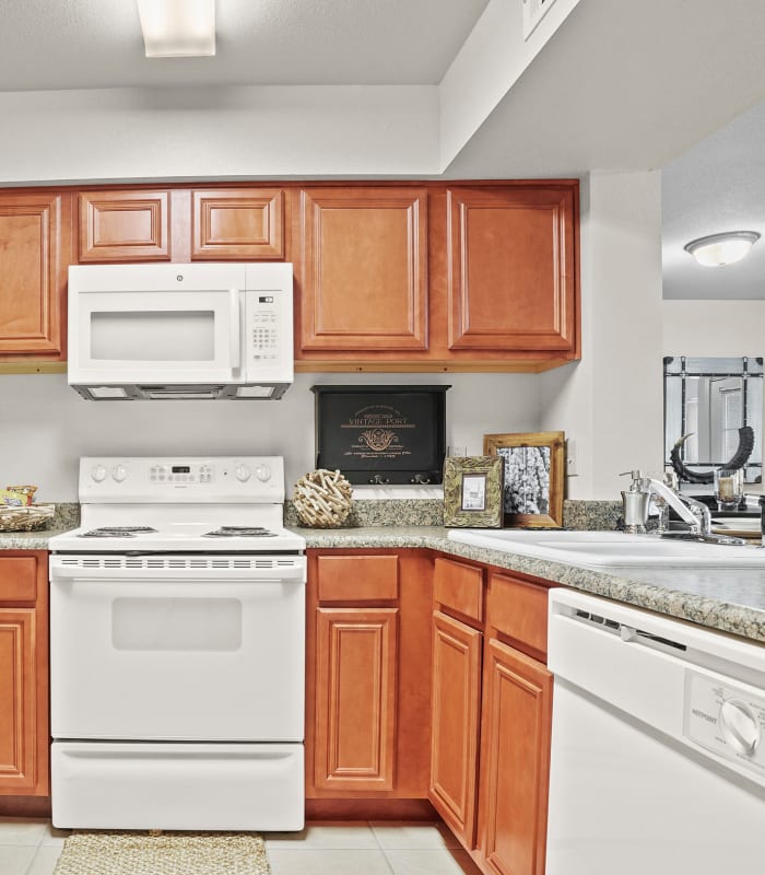 Kitchen with granite countertops at Villas of Waterford Apartments in Wichita, Kansas