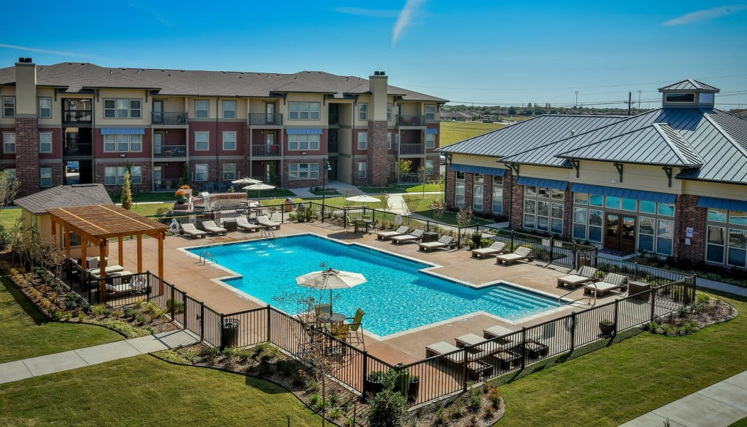Aerial view of Double Tree Apartments's gated community swimming pool in El Paso, Texas