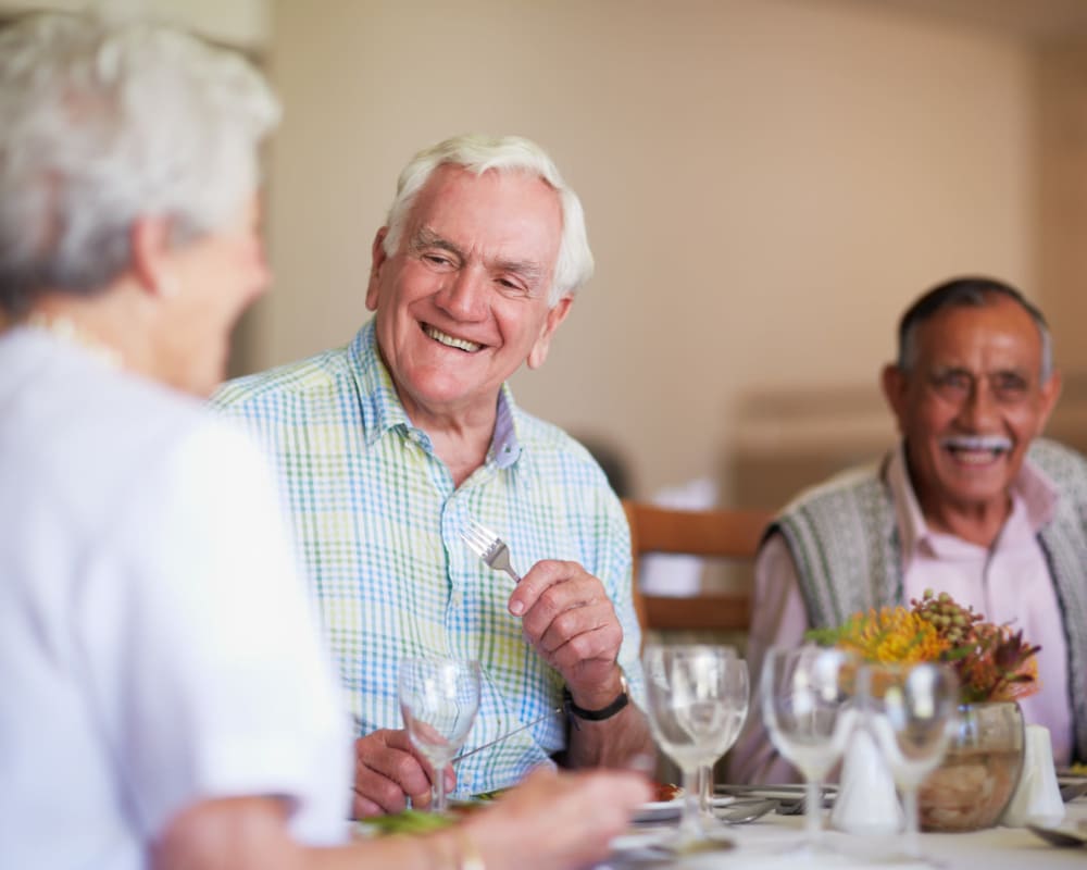 Residents talking and eating at Edencrest at Riverwoods in Des Moines, Iowa.