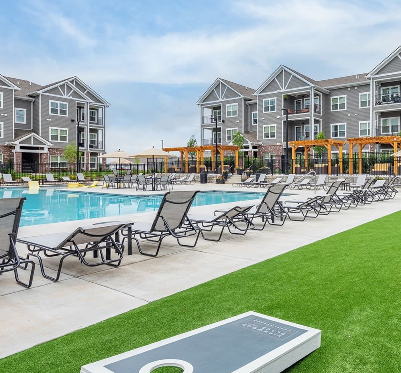 Cornhole game on the turf next to the amazing swimming pool at Kirkwood Place in Clarksville, Tennessee