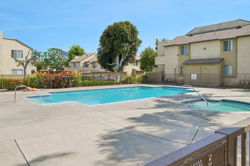 Outdoor swimming pool at Peppertree Place Apartments in Riverside, California