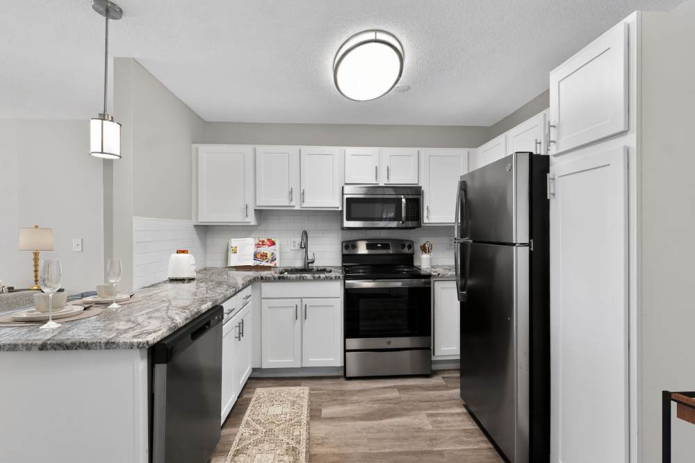 Kitchen with white cabinetry at Eagle Rock Apartments at West Hartford in West Hartford, Connecticut