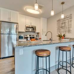 Open concept kitchen with eat-in bar Latitude at South Portland in Portland, Maine