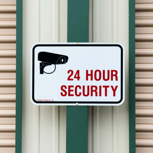 A 24 hour security sign at Red Dot Storage in Mossville, Illinois