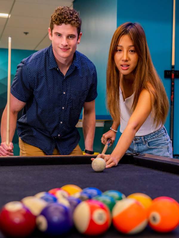 Students playing pool at Eclipse on Broad in Athens, Georgia