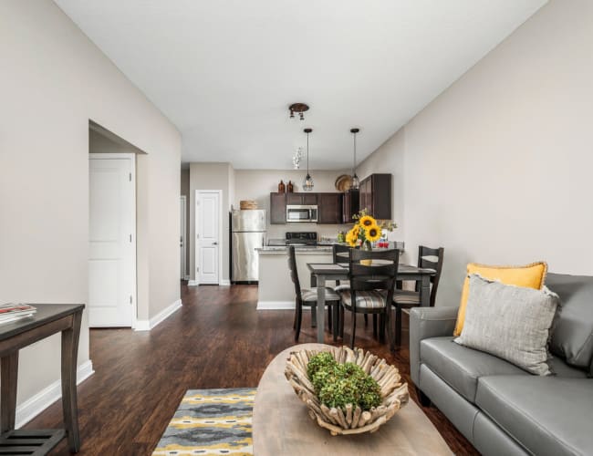 Open-concept layout with hardwood flooring in a model home at Bonterra Apartments in Fort Wayne, Indiana