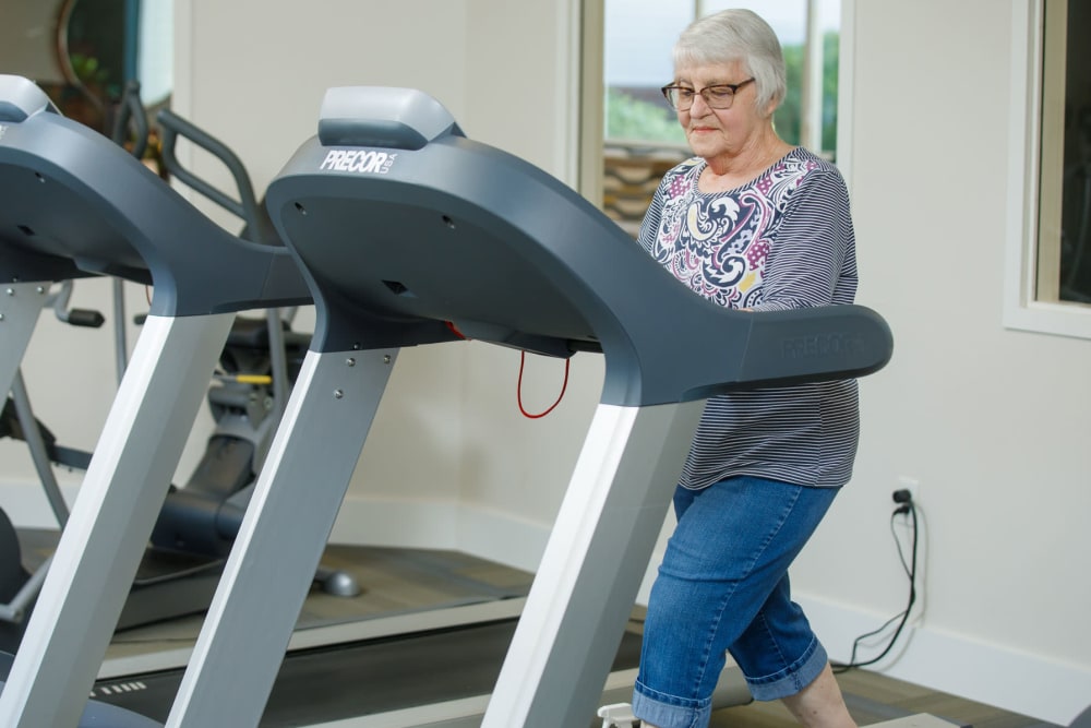 Resident on treadmill at Touchmark at Harwood Groves in Fargo, North Dakota