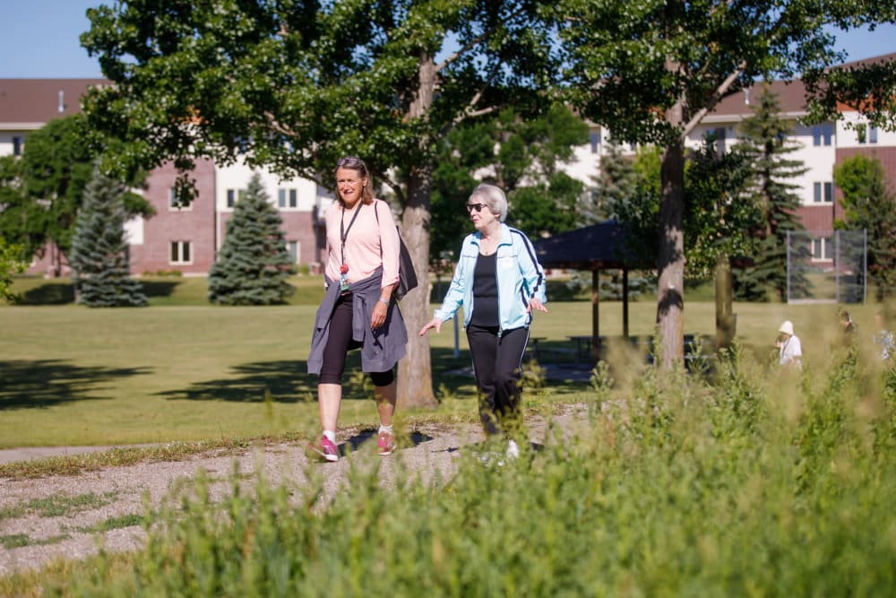 Residence walking through Touchmark at Harwood Groves in Fargo, North Dakota