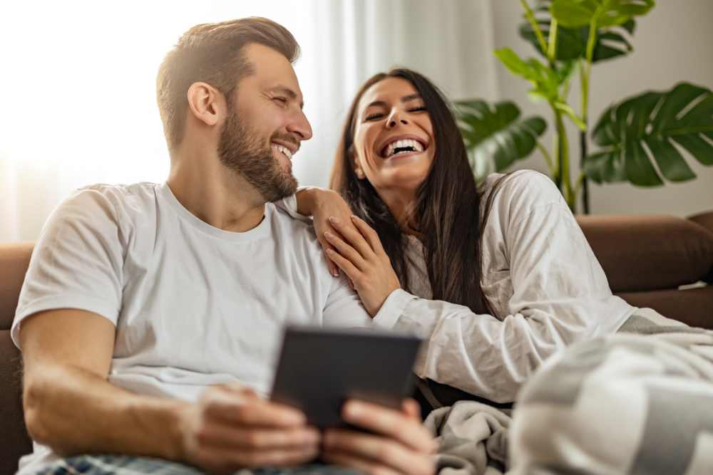 Couple on a couch at Villas at 91st in Tolleson, Arizona