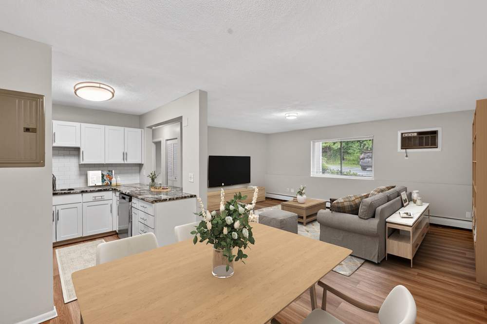 Warm and Inviting Living Area with Indoor Plants at Park Village West in Westborough, Massachusetts