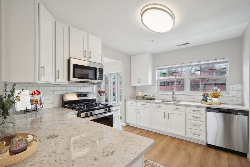 Spacious kitchen with granite countertops, stainless-steel appliances and white cabinets at Eagle Rock Apartments at Bel Air North in Forest Hill, Maryland