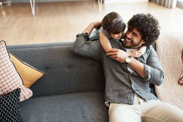 Happy father with his daughter in an apartment at Fieldhouse Apartments in Lawrenceville, Georgia