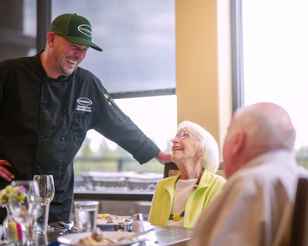 A resident ordering her meal at Touchmark on South Hill in Spokane, Washington