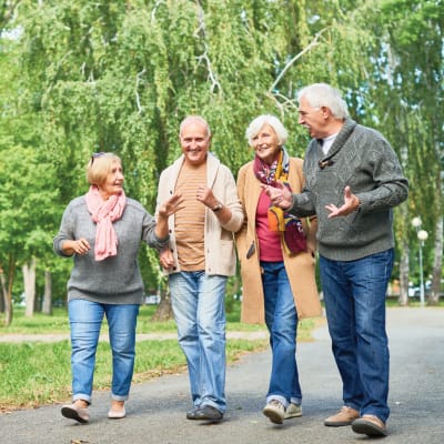 Group of seniors out for a walk near a Ebenezer Senior Living community