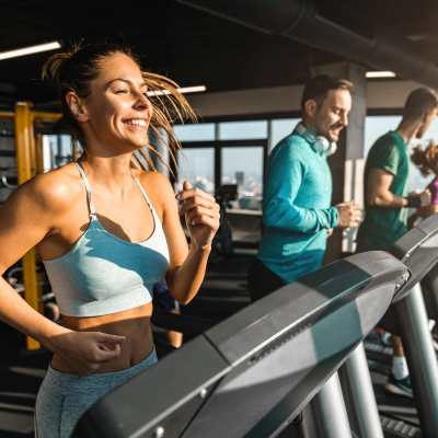 Residents doing cardio in fitness center at Ansley Murrayhill in Tigard, Oregon