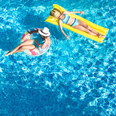 Residents floating in a swimming pool at Midway Park in Lemoore, California