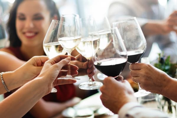 Women drinking wine near Avilla Buffalo Run in Commerce City, Colorado
