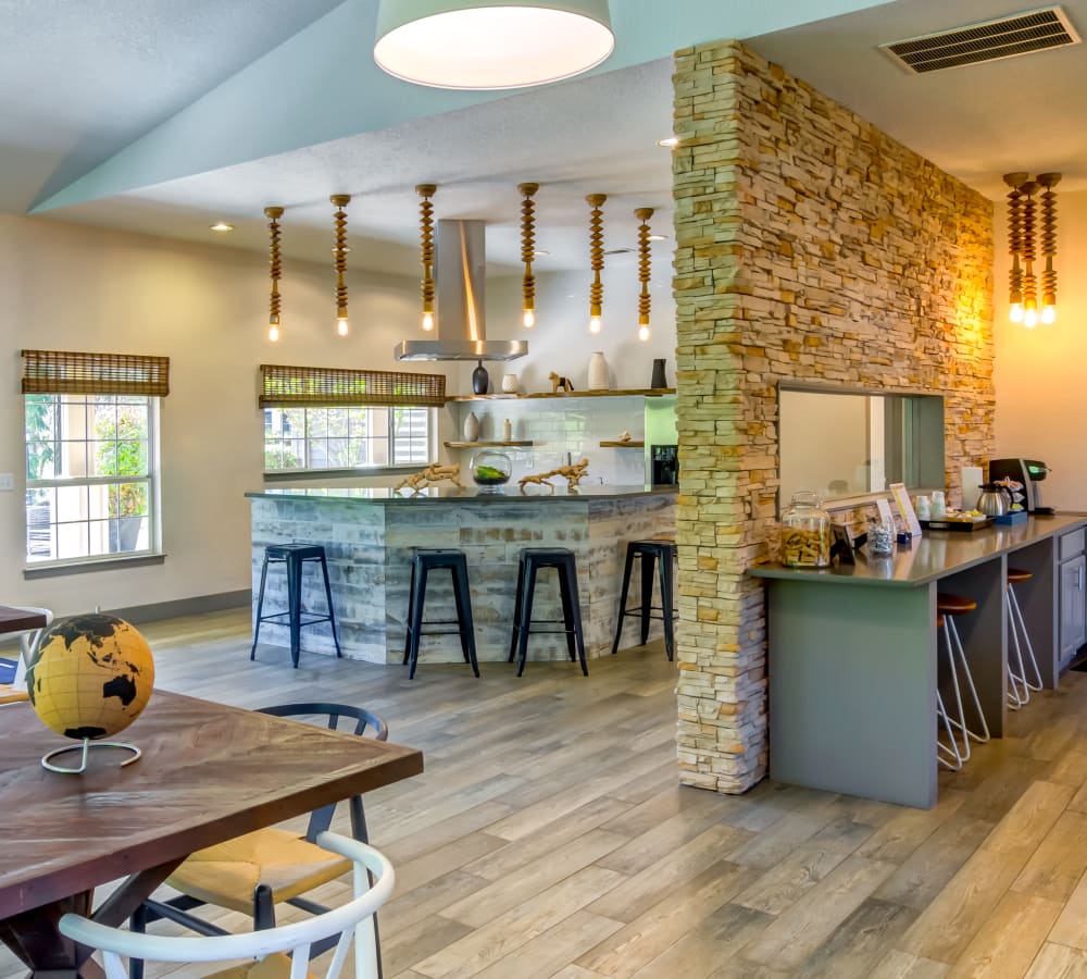 Resident clubhouse with a demonstration kitchen and complimentary coffee station at Sofi at Murrayhill in Beaverton, Oregon