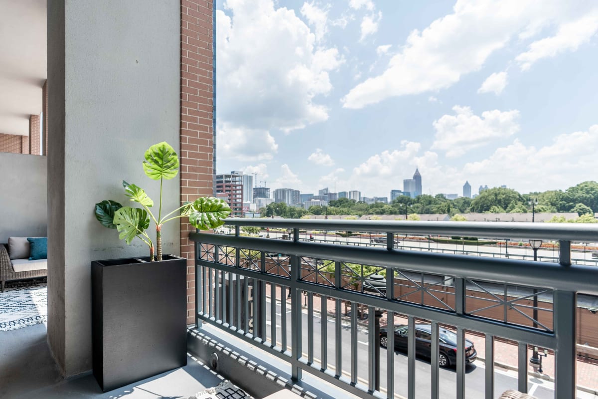 Private balcony with an incredible city view outside a model loft home at 17th Street Lofts in Atlanta, Georgia
