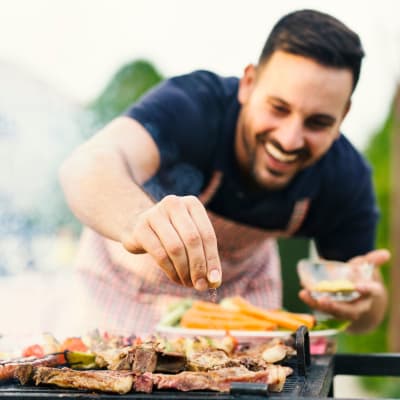 A resident grilling food at Home Terrace in San Diego, California