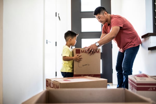A father and son packing boxes at McKinley Village Self Storage in Sacramento, California