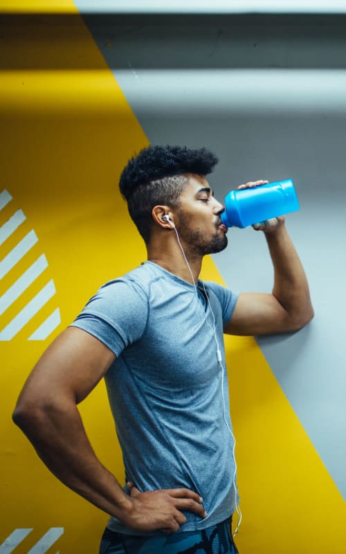 Resident drinking from a water bottle at Ascent at Silverado in Las Vegas, Nevada