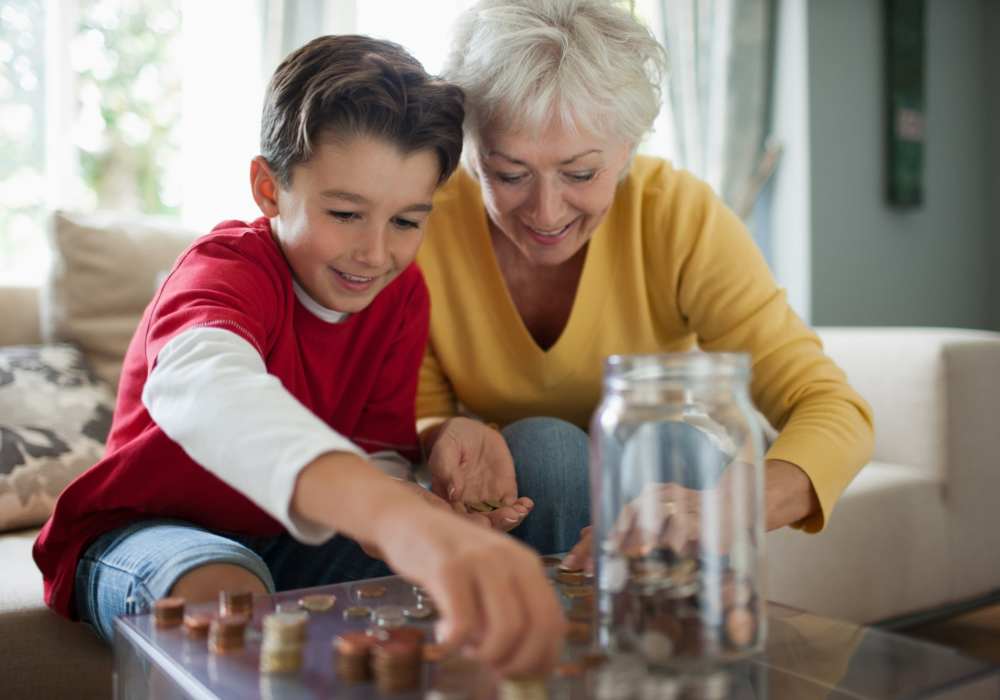 Resident and grandchild counting coins at Clearwater at South Bay in Torrance, California