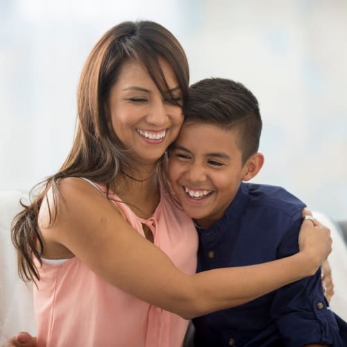 A resident hugging her child at Midway Manor in Virginia Beach, Virginia