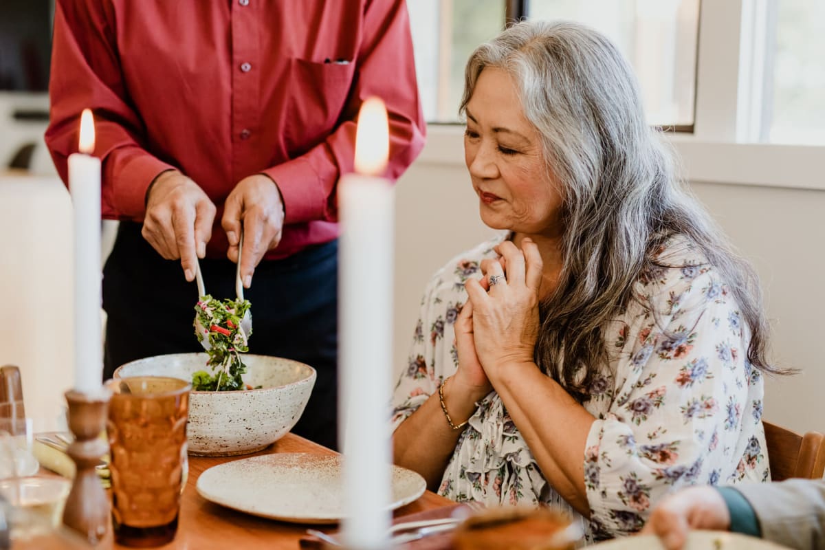 Resident couple preparing dinner in their apartment at Citrus Place in Riverside, California